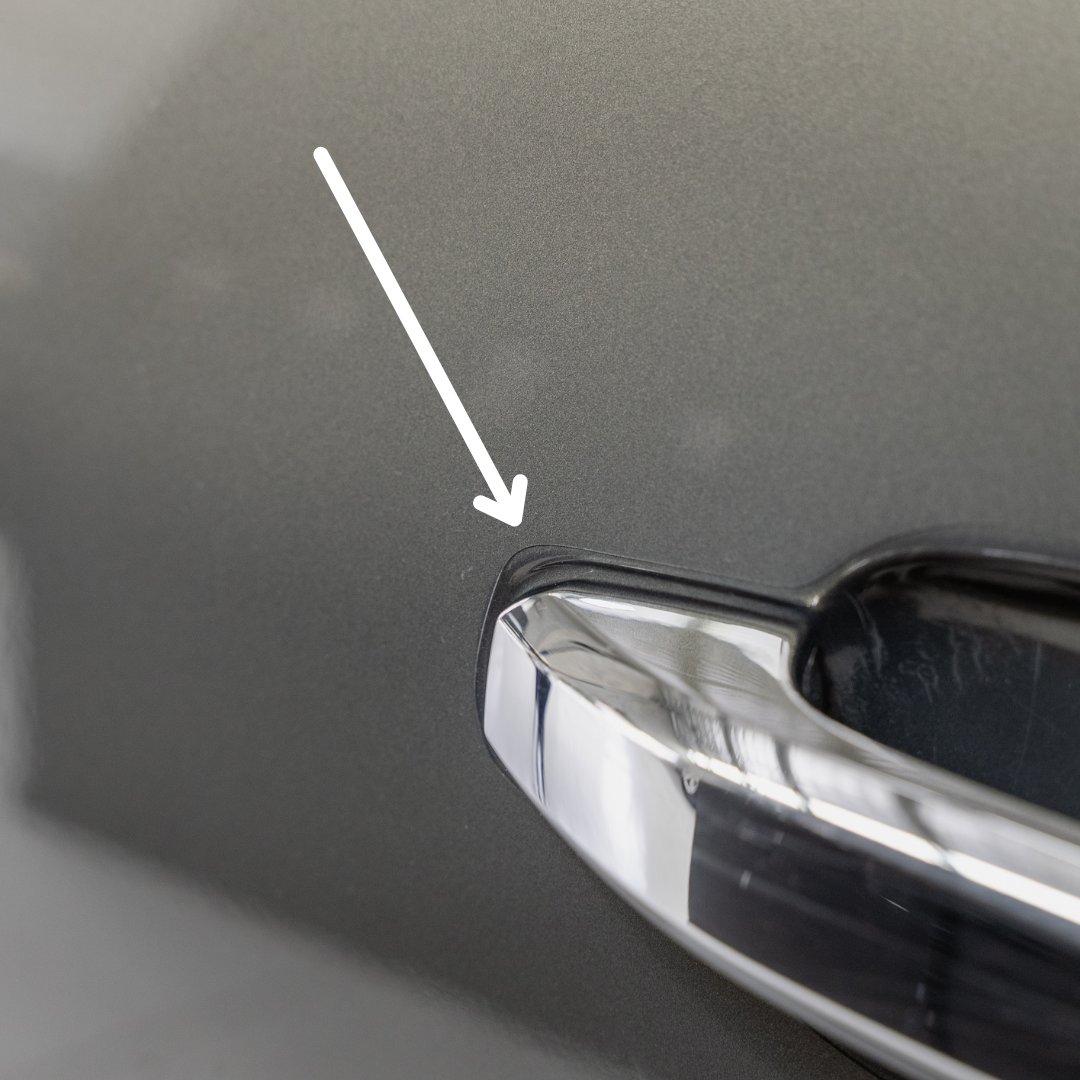 Close up displaying edge of film around door handle
